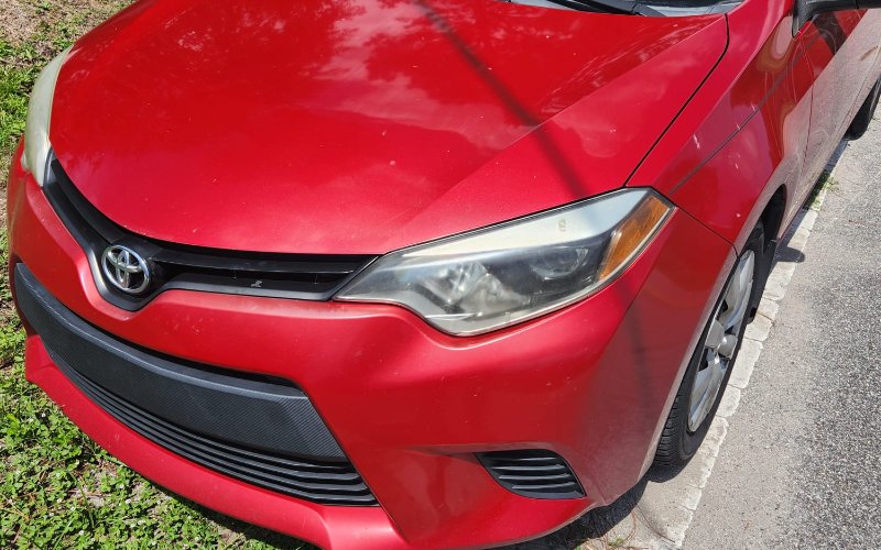 2014 Toyota Corolla · Red rental vehicle