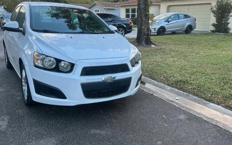 2014 Chevrolet Sonic · White rental vehicle