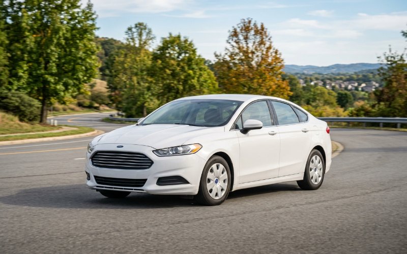 2013 Ford Fusion · White rental vehicle